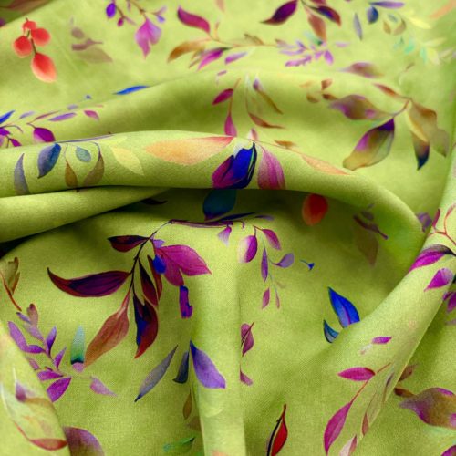 Zöld alapon leveles flokon anyag